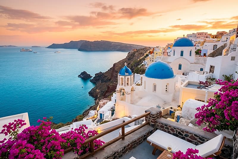 Whitewashed cliffside villas and blue-domed churches of Santorini overlooking the Aegean Sea